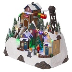 christmas village setting with skiers and chairlift