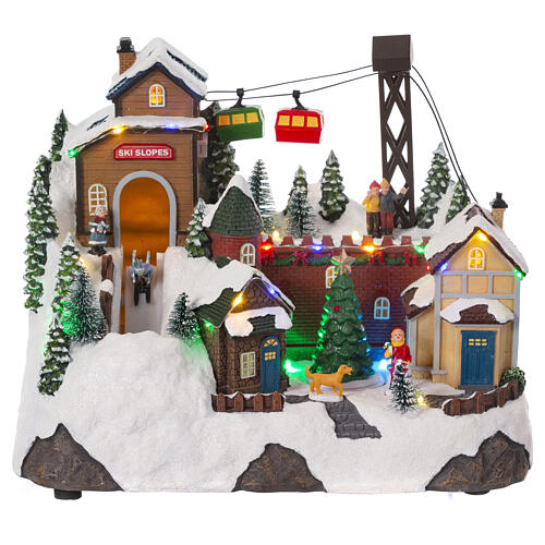 christmas village setting with skiers and chairlift